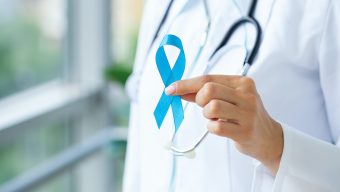 Doctor with blue ribbon, prostate cancer awareness