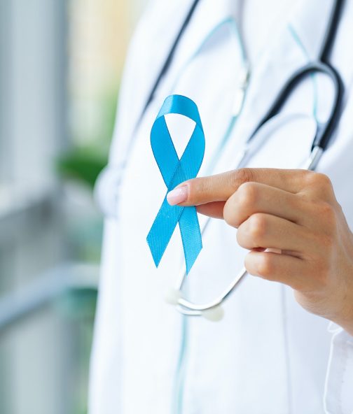 Doctor with blue ribbon, prostate cancer awareness